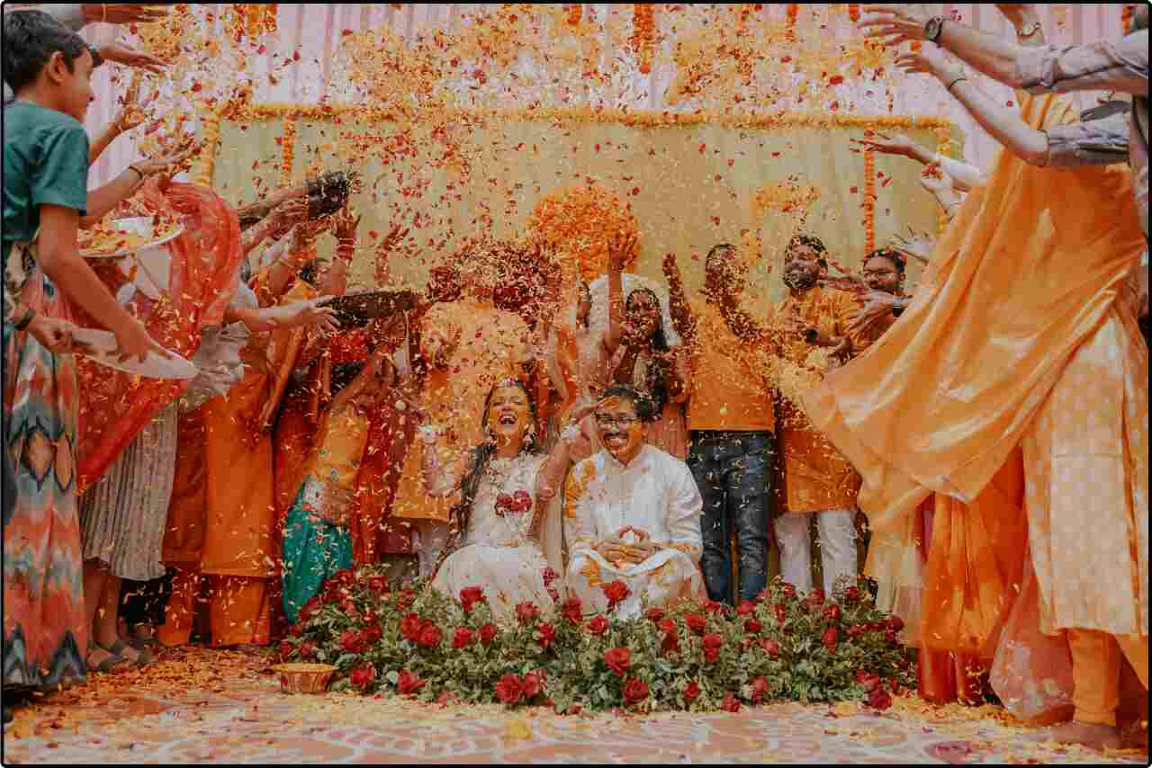 Petals of flowers cascading down on the bride and groom during their wedding